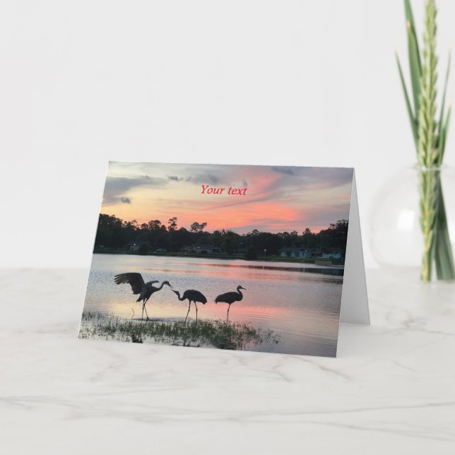 Tarjeta Festiva Silueta de grúas de arena al atardecer en el lago (Anverso)