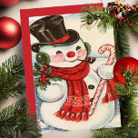 Tarjeta Festiva Snowman retro vintage en los mejores Navidades del<br><div class="desc">Esta adorable tarjeta de Navidad vintage de mediados de siglo presenta a un muñeco de nieve con un pañuelo rojo y sombrero negro de top mientras sostiene un sorbo de mistletoe en una mano un bastón de caramelo en la otra. Personalice personalizando el mensaje en la parte posterior y/o agregando...</div>