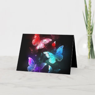 Tarjeta Festiva Tres mariposas brillantes en el fondo nocturno