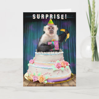 Tarjeta Festiva Un mono gracioso que sale de bananas de pasteles