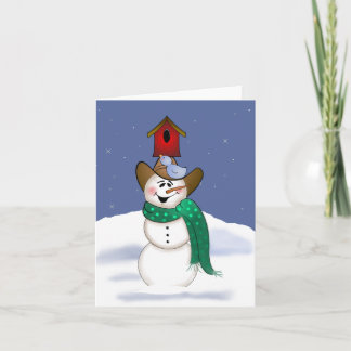 Tarjeta Festiva Vaquero hombre de nieve con casa de pájaros