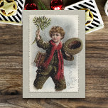 Tarjeta Festiva Vintage Boy in Snow con el saludo navideño de Feli<br><div class="desc">Un escolar de pelo rizado y alegre camina por la nieve dándole vueltas a su gorra y agitando una masa de mistletoe con un saludo de Feliz Navidad.</div>