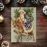 Tarjeta Festiva Vintage Christmas Card | Santa sobre un burro<br><div class="desc">Una tarjeta de Navidades victorianos linda y retro te hará reír y sonreír.</div>