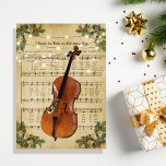 Tarjeta Festiva Vintage Christmas Sheet Music y Cello<br><div class="desc">Este hermoso diseño de tarjetas para Navidades de ballet presenta un diseño de partituras de Navidad con luces de cuerda y un violoncelo. En el interior hay un saludo personalizado de vacaciones.</div>