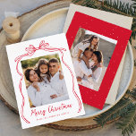 Tarjeta Festiva Vintage Red Bow Merry Christmas 2 Photo<br><div class="desc">Celebre la temporada de vacaciones con esta encantadora tarjeta de Navidades que incluye la foto de su familia enmarcada por un arco rojo festivo y una cinta en un crujiente fondo blanco. "Feliz Navidad" está elegantemente escrito en un encantador guión escrito a mano rojo, con espacio para personalizar tu nombre...</div>
