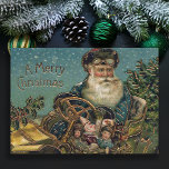 Tarjeta Festiva Vintage Santa en Roadster<br><div class="desc">Una pintoresca imagen victoriana de Santa de color dorado vestida como chofer de gorra y gafas entregando regalos en una clásica gaveta en una nevada noche de invierno.</div>