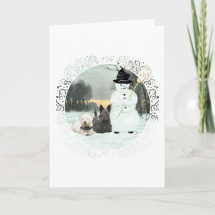 Tarjeta Festiva Westie y Scottie construyen un muñeco de nieve