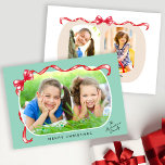 Tarjeta Festiva Whimsical Red Bow Ribbon 3 Fotos Navidades<br><div class="desc">Envía saludos de vacaciones a tu familia y amigos con esta bonita y caprichosa tarjeta de Navidades con la foto de tu familia adornada con una cinta roja festiva y un arco sobre un fondo verde claro. El diseño ofrece espacio para 2 fotos más en la parte trasera.</div>