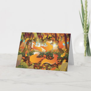 Tarjeta Festiva Zorros jugando en el bosque de otoño