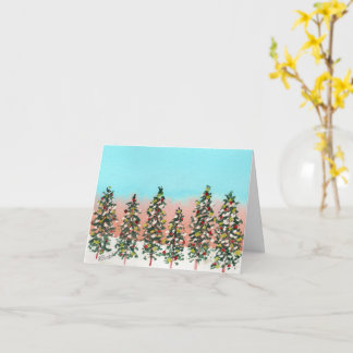 Tarjeta Fila de coloridos árboles de Navidad antes del ama