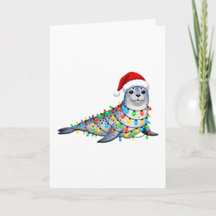 Tarjeta Foca festiva cubierta de luces de Navidad