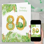 Tarjeta Foliage tropical Verde y Oro Big 80 cumpleaños<br><div class="desc">Gran tarjeta de cumpleaños 80. El diseño tiene un gran número 80 de oro texturado, entrelazado con hojas tropicales. En el exterior, también hay un borde de hojas de palma, hojas de plátano, hojas de monstera y flores tropicales coloridas con la frase "feliz cumpleaños". El interior de la tarjeta también...</div>