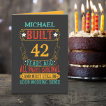Tarjeta Funny Custom Name and Years Birday<br><div class="desc">Esta tarjeta de felicitación de cumpleaños presenta un diseño vibrante y lúdico sobre un fondo negro. La parte delantera de la tarjeta muestra un nombre personalizado seguido de texto en negrita y colorido que dice: "CONSTRUIDO (número personalizado de años) AÑOS ATRÁS" de forma destacada en una mezcla de colores rojo,...</div>