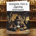Tarjeta Funny Legendary Bigfoot Birthday<br><div class="desc">Le deseo un feliz cumpleaños con esta graciosa tarjeta de cumpleaños Bigfoot. Un bar rural y occidental con una escotilla tomando una cerveza de barril deseando un cumpleaños legendario.</div>