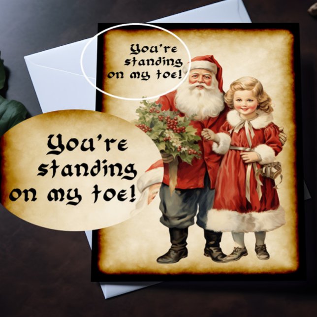 Tarjeta Funny Santa Navidades (A Victorian Christmas card with humorous picture on the front is lying on top of a desk.)