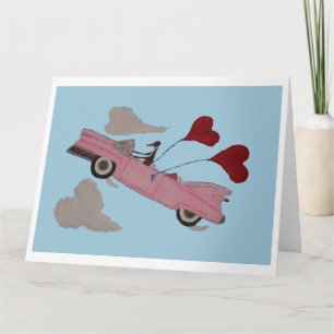 Tarjeta Galgo en convertible rosa en el cielo