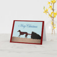 Galgo tirando un árbol de Navidad a través de la n