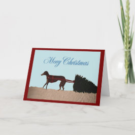 Tarjeta Galgo tirando un árbol de Navidad a través de la n