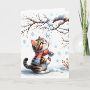 Tarjeta Gatito de Navidad mirando la nieve que cae
