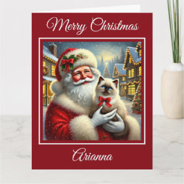 Tarjeta Gatito de Santa y Ragdoll en aldea de Navidades
