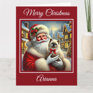Tarjeta Gatito de Santa y Ragdoll en aldea de Navidades
