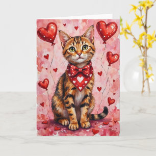 Tarjeta Gato Abisinio de San Valentín sentado con corazone