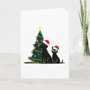Tarjeta Gato y perro negro festivo con sombreros de Santa