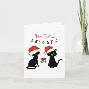 Tarjeta Gatos negros con sombreros de Santa Feliz Navidad