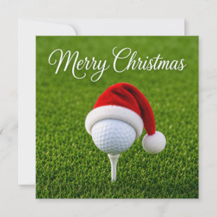 Tarjeta Golf de Navidad con sombrero de Santa en hierba ve