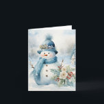 Tarjeta Gorra azul Snowman escarf Árboles cubiertos de nie<br><div class="desc">Adorable muñeco de nieve con gorra azul y bufanda junto a bonitos florales y holly en este frío día de invierno.</div>