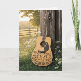 Tarjeta Guitarra de cumpleaños apoyada en un granero con c