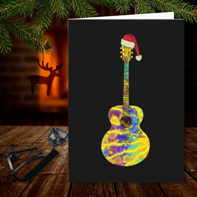 Tarjeta guitarra Santa Colorful (Funky Christmas guitar wearing a Santa hat on black music themed holiday greetings card musician)