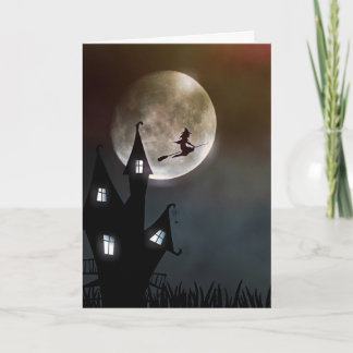 Tarjeta Halloween con brujas volando en la luna y en la ca
