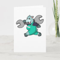 Hipopótamo como mecánico con llave inglesa