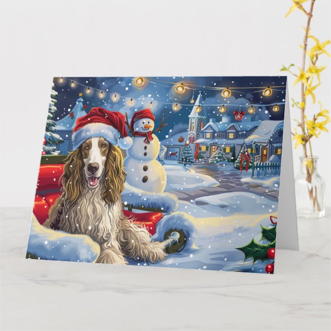 Tarjeta Hound afgano en Navidades de Nieve en Sleigh (flor amarilla)