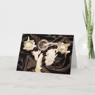 Tarjeta Huesos y velas animales en satén negro