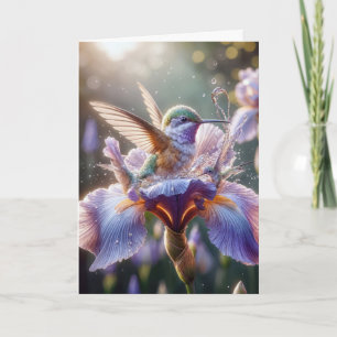 Tarjeta Hummingbird de cumpleaños en una flor de iris