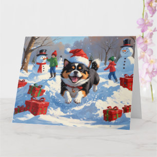 Tarjeta Japanese Chin corriendo en la nieve con sombrero d