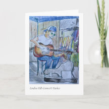 Jugador de guitarra en el mercado de agricultores 