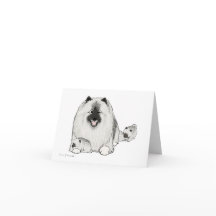 Keeshond con los perritos