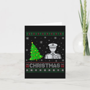 Tarjeta La policía femenina lee árbol iluminando a Navidad