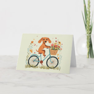 Tarjeta Lindo perro Dachshund en bicicleta con flores de p