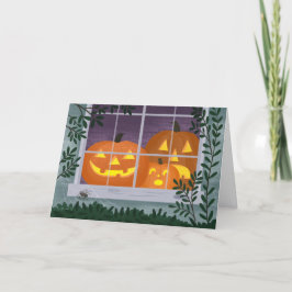 Tarjeta Linternas Jack-o' de Halloween en la ventana