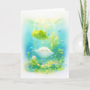 Tarjeta Manta Ray descansa bajo una almohadilla de Lily