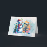 Tarjeta Merry Disk-mas | Navidades personalizados de disco<br><div class="desc">Tarjeta personalizada de Navidades con temas de golf en disco. Un personalizado de nieve de color agua dulce en Santa hat al lado de una canasta de golf en la nieve al lado de un árbol de Navidad.</div>