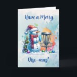 Tarjeta Merry Disk-mas | Navidades personalizados de disco<br><div class="desc">Tarjeta personalizada de Navidades con temas de golf en disco. Un personalizado de nieve de color agua dulce en Santa hat al lado de una canasta de golf en la nieve al lado de un árbol de Navidad.</div>