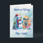 Tarjeta Merry Disk-mas | Navidades personalizados de disco<br><div class="desc">Tarjeta personalizada de Navidades con temas de golf en disco. Un personalizado de nieve de color agua dulce en Santa hat al lado de una canasta de golf en la nieve al lado de un árbol de Navidad.</div>