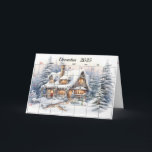 Tarjeta Mes de los Navidades de diciembre de 2025<br><div class="desc">Una cabaña nevada con un muñeco de nieve para los Navidades del 2025 de diciembre. Se puede cambiar el texto interior.</div>