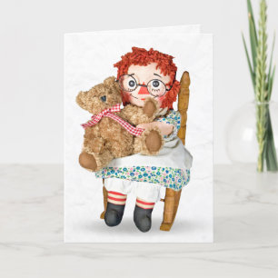 Tarjeta Muñeca de magulladura y oso de peluche en mecedora