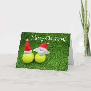 Tarjeta Navidad de tenis con sombrero de Santa en pelota d